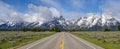Panorama of highway to mountain range in Grand Teton National Park Royalty Free Stock Photo
