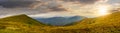 Panorama of hillside with stones in high mountains at sunset Royalty Free Stock Photo