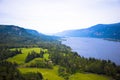 Panorama hilly banks river covered lush green trees leaving blue