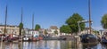 Panorama of historic ships and lock in the harbor of Gouda