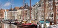 Panorama of historic ships and warehouses at the canal in Groningen