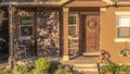 Panorama Home with pathway leading to gabled entrance of the front porch with brown door Royalty Free Stock Photo