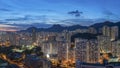 Panorama of Hong Kong city skyline and Lion Rock Hill at dusk Royalty Free Stock Photo