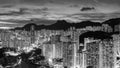 Panorama of Hong Kong city skyline and mountain Lion Rock at night Royalty Free Stock Photo