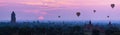 Panorama Hot air ballons over pagodas in sunrise at Bagan, Myanmar.