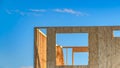 Panorama House framework at a contruction site with mound of soil in the foreground