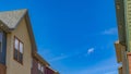 Panorama Houses with balcony and shiny windows against blue sky on a sunny day