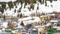 Panorama Houses and cabins on a mountain blanketed with snow in Park City Utah in winter