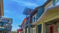 Panorama Houses with porches and balconies viewed against bright blue sky on a sunny day