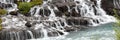 Panorama of Hraunfossar waterfall cascade in Iceland Royalty Free Stock Photo