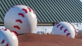 Panorama Huge baseball decoration on top of a brown mound at a playground