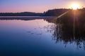 Panorama on huge lake or river with reflexion in morning with beautiful awesome pink sunrise Royalty Free Stock Photo