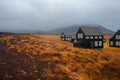 Panorama of Iceland, the harsh weather, mountains and black house