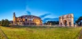 Panorama of Illuminated Colosseum and Constantine Arch at Dusk, Rome Royalty Free Stock Photo