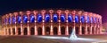 Panorama of illuminated Roman amphitheater, Nimes