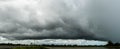 Dark Sky, and dramatic black cloud before the rain. rainy storm over the river with the road, Sisaket province, Royalty Free Stock Photo