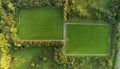 Panorama image of two football training field in a park. Aerial drone view. Soccer pitch view from top. Nobody