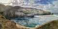 Panorama image of white sandstone cliffs at the Tunnel beach in Dunedin in the afternoon