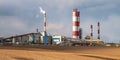 Panorama of industrial landscape environmental pollution waste of thermal power plant. Big pipes of chemical industry enterprise Royalty Free Stock Photo