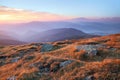 Panorama with interesting sunrise enlightens surroundings. Landscape with beautiful mountains and stones. Fantastic autumn scenery Royalty Free Stock Photo