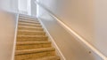 Panorama Interior of a house with a staircase covered with brown carpet Royalty Free Stock Photo