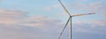 Panorama of isolated wind turbine in the morning sky