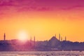 Istanbul at sunset with silhouettes of mosques.