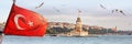Panorama of Istanbul with Maiden Tower, kiz kulesi, at skyline and seagulls over the sea, wide landscape with the Turkish flag in Royalty Free Stock Photo