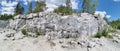 Panorama of an Italian quarry with smooth sections of marble in the Ruskeala Mountain Park on a sunny summer day