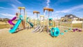 Panorama Kids playground with colorful blue slides during day