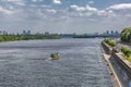 Panorama of Kiev, River Dnipro, Ukraine. The view from the pedestrian bridge. Yellow motor ship is floating downstream.