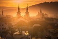 Panorama of less known Prague churches and towers, sunset golden light, smoke and roofs