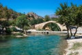 Panorama of kourtaliotis river and a stone arch bridge at Preveli, Crete