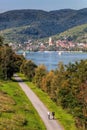 Panorama of Krems town with bikers next to Danube river in Wachau valley, Lower Austria, Austria Royalty Free Stock Photo