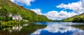 Kylemore Abbey, beautiful castle like abbey reflected in lake at the foot of a mountain. Ireland