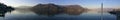 panorama of lake garda at dawn with light haze Royalty Free Stock Photo