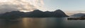 Panorama of Lake Iseo and mountains background at sunrise Royalty Free Stock Photo
