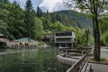 Panorama of lake Kleptuza toward karst spring and waterfall Royalty Free Stock Photo