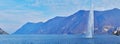 Panorama of Lake Lugano with fountain and Alps in background, Lugano, Switzerland Royalty Free Stock Photo