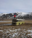 Panorama landscape of abandoned forgotten remote rural idyllic isolated magic bus schoolbus in Hunavatn Northern Iceland