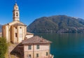 Panorama landscape on beatiful Lake Como in Lombardy, Italy. Scenic small town with traditional houses and clear blue water.