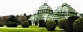 Panorama Landscape of botanical palm house architecture and field trees outdoors in Vienna, Austria Royalty Free Stock Photo