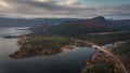 Panorama landscape with road along lake and mountains in Stora SjÃ¶fallet National Park in autumn in Lapland in Sweden from above Royalty Free Stock Photo