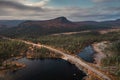 Panorama landscape with road along lake and mountains in Stora SjÃ¶fallet National Park in autumn in Lapland in Sweden from above Royalty Free Stock Photo