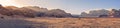 Panorama landscape shot of Wadi Rum desert in Jordan during golden hour