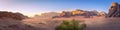 Panorama landscape shot of Wadi Rum desert in Jordan during golden hour Royalty Free Stock Photo