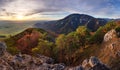 Panorama landscape at sunset with autumn forest, rocks, sun and mountain Royalty Free Stock Photo