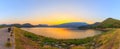 Panorama Landscape of sunset on Mountain In the lake ,Sukhothai,Thailand Royalty Free Stock Photo