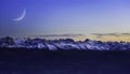 Panorama landscape view of Alps in Switzerland from the top of Rigi Kulm on twilight time and C-shaped of the moon Royalty Free Stock Photo