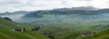 Panorama landscape view of the beautiful Appenzell region in Switzerland with ist rolling hills and farms and the Alpstein mountai